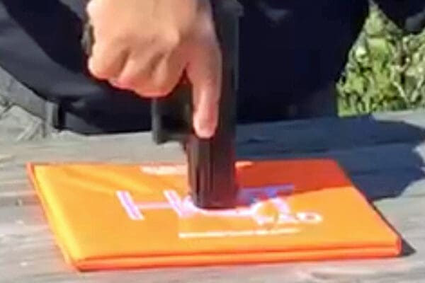 A person using a knife to cut paper