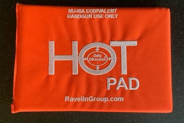 A red hot pad with the words " hot pad " written on it.